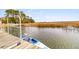 Kayaks at a private boat dock offering scenic waterfront views and tranquil access to the water at 12 Trachelle Ln, Charleston, SC 29407