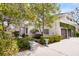 Charming home exterior with manicured landscaping, driveway, and attached garage with green climbing vines at 12 Trachelle Ln, Charleston, SC 29407