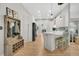 A well-lit kitchen featuring white cabinets, stainless steel appliances, and a breakfast bar at 12 Trachelle Ln, Charleston, SC 29407