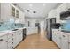 Spacious kitchen features stainless appliances, white cabinets, and a central island at 12 Trachelle Ln, Charleston, SC 29407