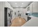 Well-equipped kitchen boasts stainless steel appliances, white cabinetry, and tile backsplash at 12 Trachelle Ln, Charleston, SC 29407