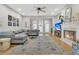 Bright living room featuring hardwood floors, fireplace, and comfortable seating arrangement at 12 Trachelle Ln, Charleston, SC 29407