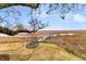 A scenic marsh view featuring a blue tree swing and a tranquil boardwalk at 12 Trachelle Ln, Charleston, SC 29407