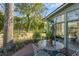 Inviting backyard space with a glass table and outdoor seating under a tree at 1228 Penny Cir, Mount Pleasant, SC 29464