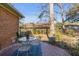 Relaxing backyard featuring a wooden deck with outdoor seating and a peaceful garden at 1228 Penny Cir, Mount Pleasant, SC 29464