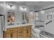 Bright bathroom with double vanity, subway tiles, glass enclosed shower and black and white tiled floor at 1228 Penny Cir, Mount Pleasant, SC 29464