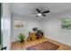 Spacious bedroom with a fan, natural light, wood floors and a colorful area rug at 1228 Penny Cir, Mount Pleasant, SC 29464