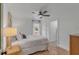 Bright bedroom with wood floors, ceiling fan and ensuite bathroom at 1228 Penny Cir, Mount Pleasant, SC 29464
