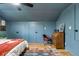Bedroom featuring hardwood floors, blue painted walls, and built in cabinets at 1228 Penny Cir, Mount Pleasant, SC 29464