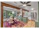Bright dining area with modern lighting, comfortable seating, and seamless connection to the kitchen at 1228 Penny Cir, Mount Pleasant, SC 29464