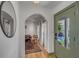 Stylish foyer with an arched doorway, hardwood floors, and a glimpse into the living space at 1228 Penny Cir, Mount Pleasant, SC 29464