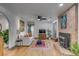 Cozy living room with a fireplace, modern sofa, and stylish decor creating a comfortable ambiance at 1228 Penny Cir, Mount Pleasant, SC 29464