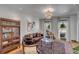 Bright living room featuring a leather sofa, stylish rug, and ample natural light from large windows at 1228 Penny Cir, Mount Pleasant, SC 29464