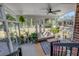 Bright sunroom with ample windows, ceiling fan, and views of the lush backyard at 1228 Penny Cir, Mount Pleasant, SC 29464