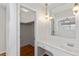 Bathroom vanity with a large mirror, sink, drawers, and stylish pendant lighting at 1258 Redeemer Dr, Hanahan, SC 29410
