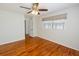 Bedroom showcasing hardwood floors, ceiling fan, and large window offering natural light at 1258 Redeemer Dr, Hanahan, SC 29410