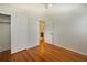 Bedroom with wood floors, closet space, and a peek into an en suite bathroom at 1258 Redeemer Dr, Hanahan, SC 29410