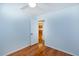 Cozy bedroom featuring hardwood floors, ceiling fan, and a doorway leading to other rooms at 1258 Redeemer Dr, Hanahan, SC 29410