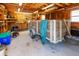 Well-lit garage interior with a wooden trailer, tools, storage shelves, and a neat and organized layout at 1258 Redeemer Dr, Hanahan, SC 29410