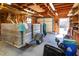 Organized garage featuring a wooden trailer, overhead lighting, and ample storage space for tools and equipment at 1258 Redeemer Dr, Hanahan, SC 29410