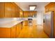 Well-lit kitchen with stainless steel appliances, wooden cabinets, and white countertops at 1258 Redeemer Dr, Hanahan, SC 29410