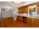 A kitchen featuring traditional-style wood cabinetry, stainless appliances, and an adjacent room at 1258 Redeemer Dr, Hanahan, SC 29410