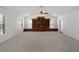 Well-lit living room with large built-in shelving, neutral carpeting, and a bright airy feel at 1258 Redeemer Dr, Hanahan, SC 29410