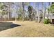 Spacious fenced back yard with grass, trees, garden space and room for play at 126 Moon Shadow Ln, Summerville, SC 29485