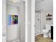 Bright bathroom featuring a glass-enclosed shower and modern vanity with sunflower art at 126 Moon Shadow Ln, Summerville, SC 29485