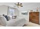 Well-lit bedroom with ceiling fan, tv, and natural lighting coming through a window at 126 Moon Shadow Ln, Summerville, SC 29485