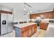Spacious kitchen features stainless steel appliances, cherry cabinets, and a central island with seating at 126 Moon Shadow Ln, Summerville, SC 29485