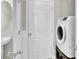 Modern laundry room with white washer and dryer, sink, and white door at 126 Moon Shadow Ln, Summerville, SC 29485