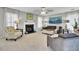 Cozy living room with fireplace, ample seating, neutral carpet, and bright windows at 126 Moon Shadow Ln, Summerville, SC 29485