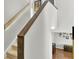 View of carpeted stairs with wood handrail looking into downstairs living area at 126 Moon Shadow Ln, Summerville, SC 29485