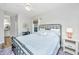 Comfortable bedroom featuring a decorative mirror, desk, and a bright window at 1300 Park West Blvd # 418, Mount Pleasant, SC 29466