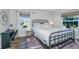 Bedroom featuring a desk, decorative mirror and light-filled windows with privacy shades at 1300 Park West Blvd # 418, Mount Pleasant, SC 29466