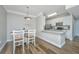 Charming dining area with a decorative light fixture, a kitchen bar, and space for entertaining at 1300 Park West Blvd # 418, Mount Pleasant, SC 29466