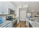 Bright open kitchen with granite countertops, stainless appliances, and natural light at 1300 Park West Blvd # 418, Mount Pleasant, SC 29466