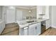 Modern kitchen featuring granite countertops, stainless steel dishwasher and wood flooring at 1300 Park West Blvd # 418, Mount Pleasant, SC 29466