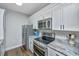 A modern kitchen with stainless steel appliances and granite countertops at 1300 Park West Blvd # 418, Mount Pleasant, SC 29466