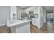 Bright kitchen with granite countertops, white cabinets, and stainless steel appliances at 1300 Park West Blvd # 418, Mount Pleasant, SC 29466