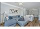 Spacious living room with modern furniture, decor, an open floor plan, and lots of natural light at 1300 Park West Blvd # 418, Mount Pleasant, SC 29466