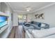 Comfortable living room with modern furnishings, decorative art, and a sliding glass door to the patio at 1300 Park West Blvd # 418, Mount Pleasant, SC 29466