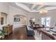 The spacious living room has hardwood floors, stylish furniture, and an elegant chandelier at 1300 Park West Blvd # 418, Mount Pleasant, SC 29466