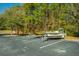 Parking lot for boat storage with boats on trailers and forest in the background at 1300 Park West Blvd # 418, Mount Pleasant, SC 29466
