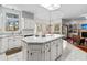 Kitchen island featuring a cooktop and ample storage space, complete with a tiled countertop at 1407 Congressional Blvd, Summerville, SC 29483