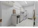 Functional laundry room with washer, dryer, utility sink, and storage cabinets at 1407 Congressional Blvd, Summerville, SC 29483