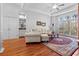 Bright living room with hardwood floors, neutral furniture, and a large window at 1407 Congressional Blvd, Summerville, SC 29483
