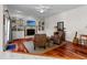 Cozy living room with hardwood floors, a fireplace, and built-in bookshelves at 1407 Congressional Blvd, Summerville, SC 29483