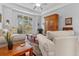 Inviting living room with hardwood floors, a large window, and comfortable, neutral furniture at 1407 Congressional Blvd, Summerville, SC 29483